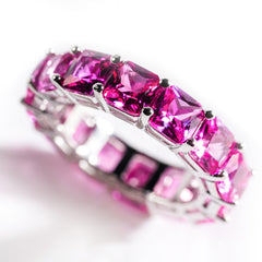 Tennis ring with pink gemstones