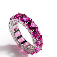 Tennis ring with pink gemstones